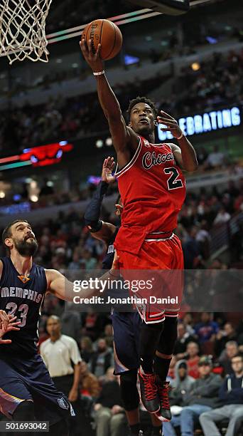 Jimmy Butler of the Chicago Bulls goes up past Marc Gasol of the Memphis Grizzlies for a shot on his way to a game-high 24 points at the United...