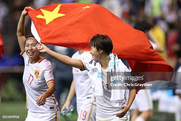 Wang Shuang and Gu Yasha of China celebrate after defeating the United States 1-0 at the Mercedes-Benz Superdome on December 16, 2015 in New Orleans,...