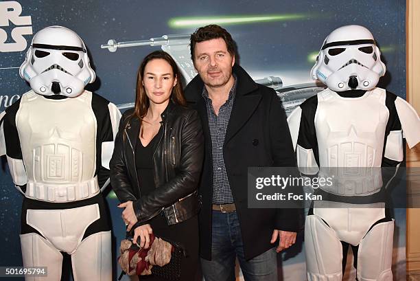 Actors Vanessa Demouy and Philippe Lellouche pose with 'Stormtroopers' during the 'Star Wars: Episode VII - The Force Awakens' Screening Party Hosted...