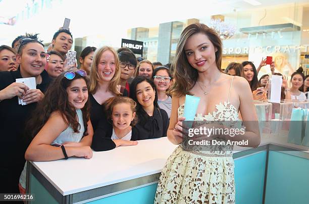 Miranda Kerr poses alongside fans at Westfield Bondi Junction on December 17, 2015 in Sydney, Australia.