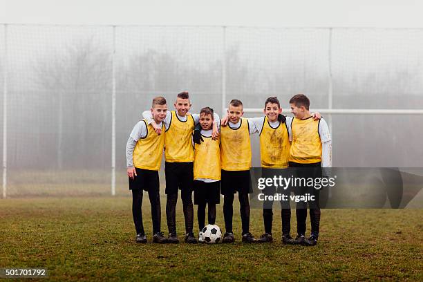 kids team photo after playing soccer. - boy playing soccer stock pictures, royalty-free photos & images