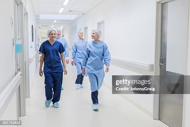 surgical team walking down hospital corridor, front view - australia nsw stockfoto's en -beelden