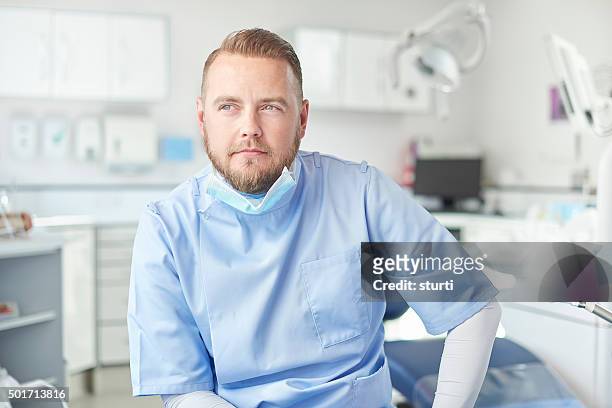 male dentist portrait - nurse thinking stock pictures, royalty-free photos & images