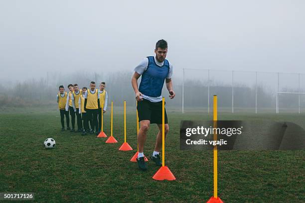 soccer training for kids. - traffic cone stock pictures, royalty-free photos & images