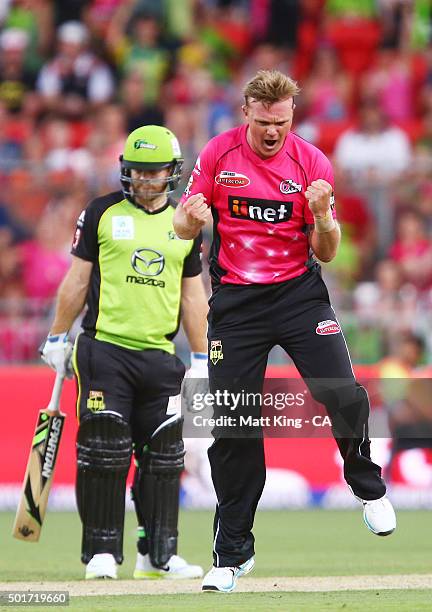 Doug Bollinger of the Sixers celebrates taking the wicket of Aiden Blizzard of the Thunder during the Big Bash League match between the Sydney...