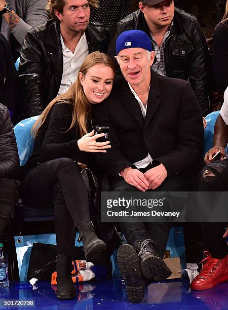 Anna McEnroe and John McEnroe attend the Minnesota Timberwolves vs New York Knicks game at Madison Square Garden on December 16, 2015 in New York...