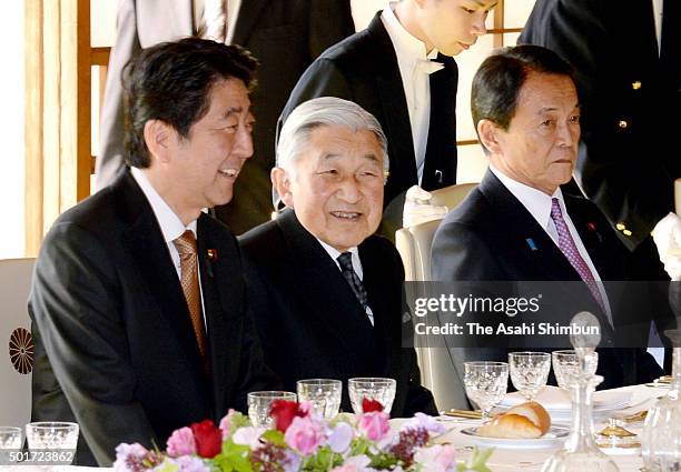 Emperor Akihito talks with Prime Minister Shinzo Abe during the luncheon inviting cabinet members at the Imperial Palace on December 16, 2015 in...