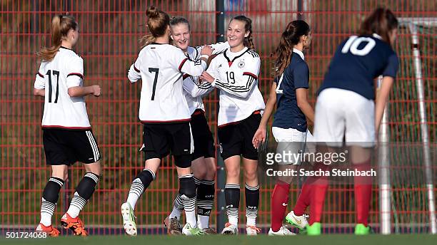 Michelle Herrmann of Germany celebrates with team mates after scoring the opening goal during the U17 girl's international friendly match between...