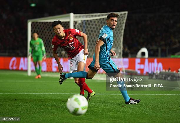 Munir El Haddadi of Barcelona and Zou Zheng of Guangzhou Evergrande FC challenge for the ball during the FIFA Club World Cup Semi Final match between...