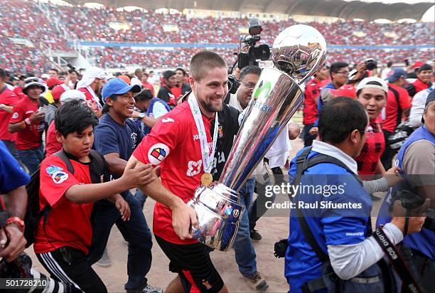 Werner Schuler of FBC Melgar celebrates with the trophy after winning a second leg final match between FBC Melgar and Sporting Cristal as part of...