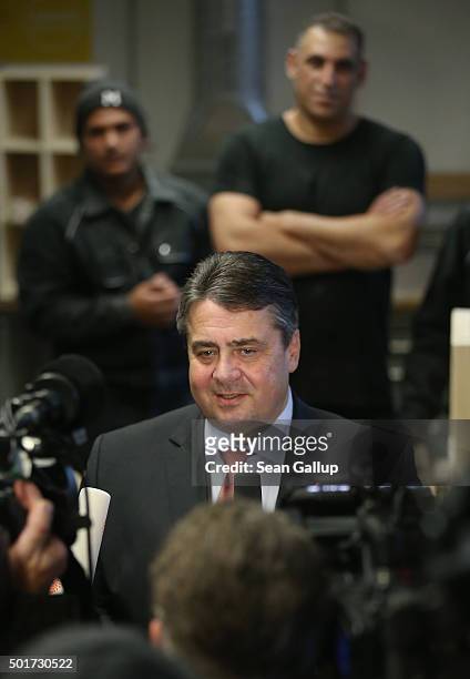 German Vice Chancellor and Economy and Energy Minister Sigmar Gabriel speaks to the media as asylum-applicants from Kosovo and Lebanon participating...