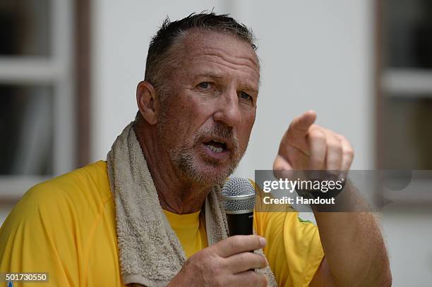 In this handout image provided by Philip Brown, Sir Ian Botham speaks after completing the 'Beefy Walking the Rainbow Nation' charity walks on...