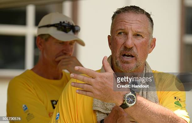 In this handout image provided by Philip Brown, Sir Ian Botham speaks after completing the 'Beefy Walking the Rainbow Nation' charity walks on...
