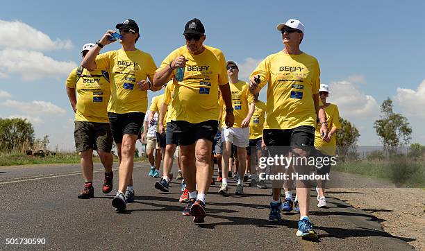 In this handout image provided by Philip Brown, Sir Ian Botham and his supporters walk during the 'Beefy Walking the Rainbow Nation' charity walk...