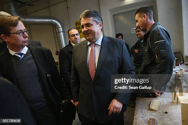 German Vice Chancellor and Economy and Energy Minister Sigmar Gabriel departs after visiting a cabinet-making tradecrafts exposure program for...