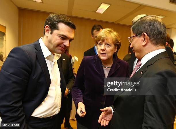 Turkish Prime Minister Ahmet Davutoglu speaks with German Chancellor Angela Merkel and Greek Prime Minister Alexis Tsipras at the Steigenberger Hotel...