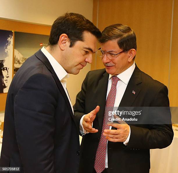 Turkish Prime Minister Ahmet Davutoglu speaks with G Greek Prime Minister Alexis Tsipras at the Steigenberger Hotel during his visit in Brussels,...