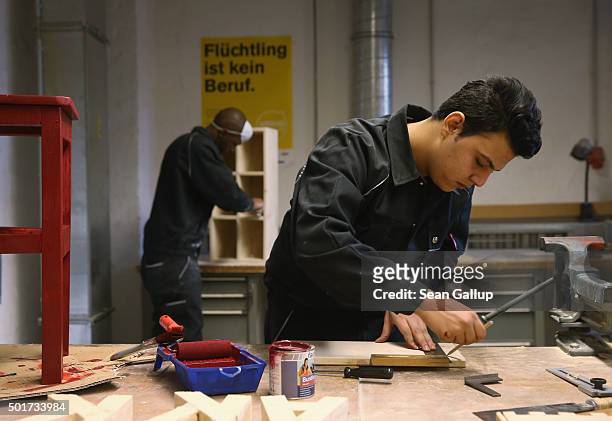 Asylum-applicants from Syria and Africa participate in the cabinet-making tradecrafts exposure program at the Arrivo center on December 17, 2015 in...