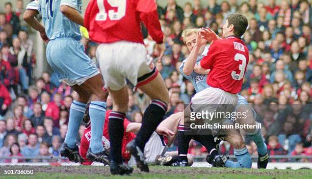 Coventry City defender David Busst breaks his leg resulting in extensive compound fractures to both the tibia and fibula of his right leg after...