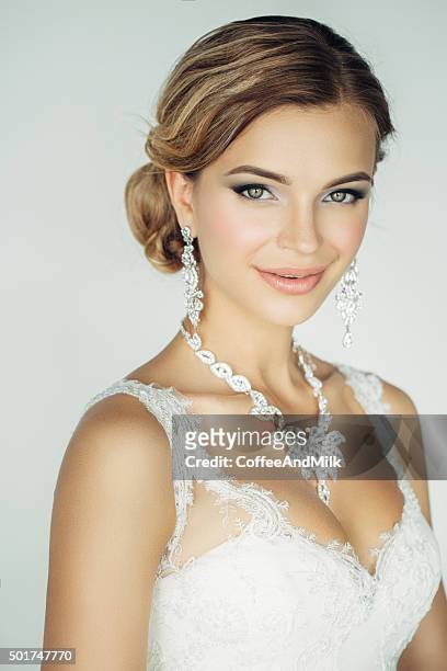 studioshot of young beautiful bride on light background - bridal makeup stock pictures, royalty-free photos & images