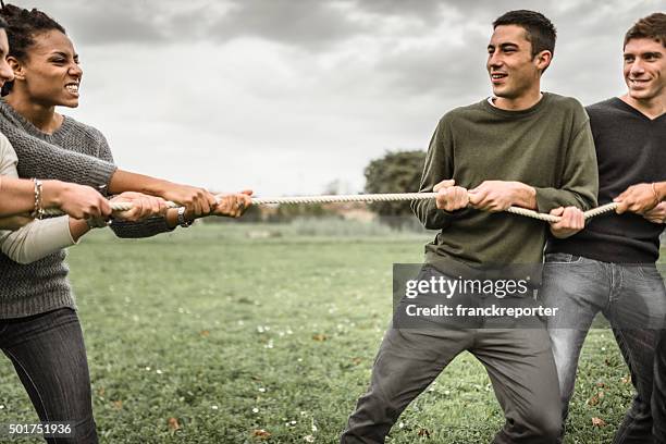 Friends Rope Pull 685 Friends Doing The Tug Of War Teamwork Stock Photos, High-Res ...
