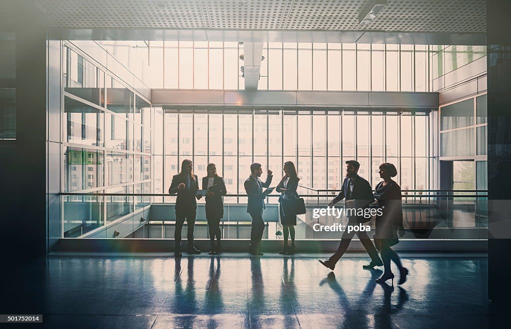 Business people in lobby walking