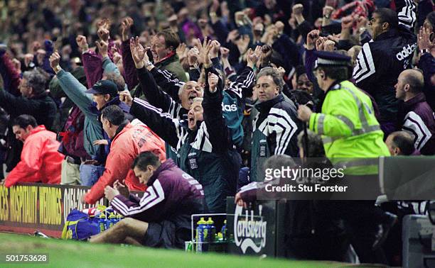Liverpool manager Roy Evans and coach Ronnie Moran celebrate Stan Collymore's stoppage time winner as Newcastle player Steve Howey and management duo...
