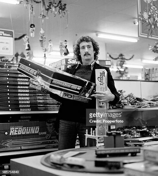 Derby County footballer Gerry Ryan Christmas shopping in Debenham's toy department in Derby on 8th December 1977.
