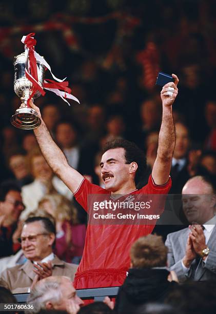 Aberdeen captain Willie Miller lifts the trophy after the 1986 Scottish Cup Final between Aberdeen and Heart of Midlothian at Hampden Park on May 10,...