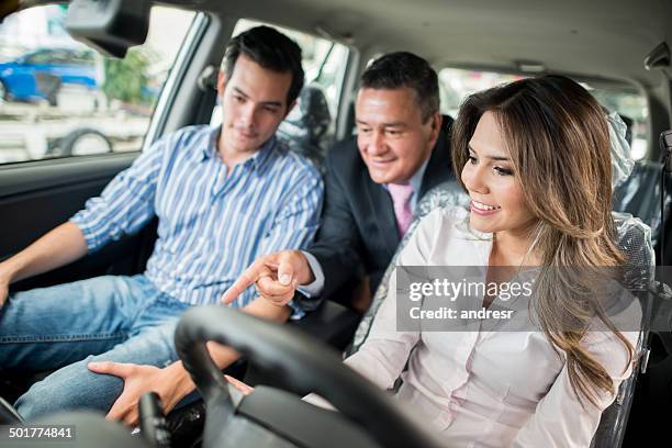 couple buying a new car - customer test drive stock pictures, royalty-free photos & images