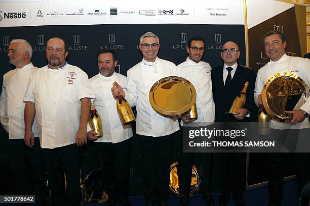 Benoit Violier , Chef of the Restaurant de l'Hotel de Ville, poses with French chef Guy Savoy, French chef Gilles Goujon, French chef Michel...