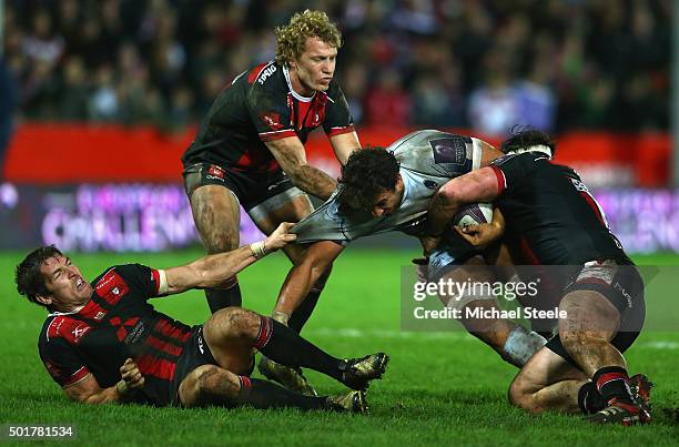 Marco Mama of Worcester is tackled by Dan Murphy , Billy Twelvetrees and James Hook of Gloucester during the European Rugby Challenge Cup Round Four...