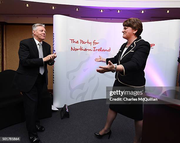 The new DUP leader Arlene Foster is congratulated by outgoing leader Peter Robinson at the Park Avenue hotel after the Democratic Unionist Party...