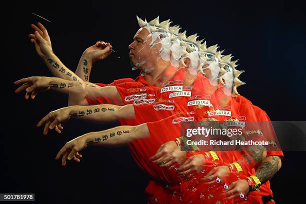 Peter Wright throws against Keegan Brown during the first round on day one of the 2016 William Hill PDC World Darts Championships at Alexandra Palace...