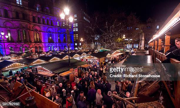 Shoppers enjoy Manchester's Christmas Market with food stalls, bar's, Christmas decorations and various gift stalls outside Manchester Town Hall on...