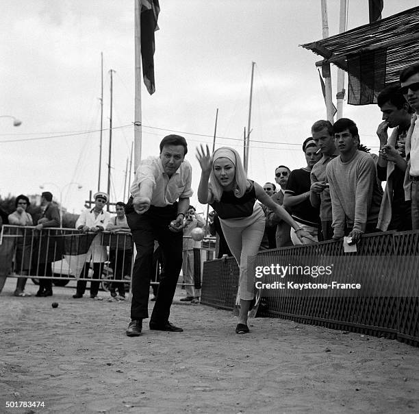 The duet Maurice Biraud and Elga Andersen winners of the traditional petanque contest of Cannes Film Festival, on May 18, 1963 in Cannes, France.