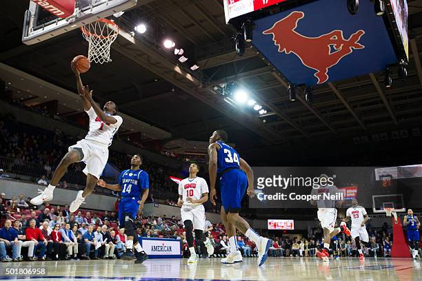 Shake Milton of the SMU Mustangs drives to the basket against the Hampton Pirates on December 17, 2015 at Moody Coliseum in Dallas, Texas.
