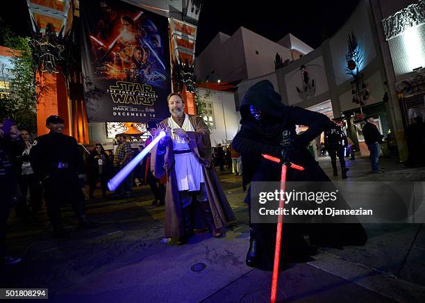 Fans dressed as Obi-Wan Kenobi and Kylo Ren are seen during the opening night of Walt Disney Pictures and Lucasfilm's "Star Wars: The Force Awakens"...