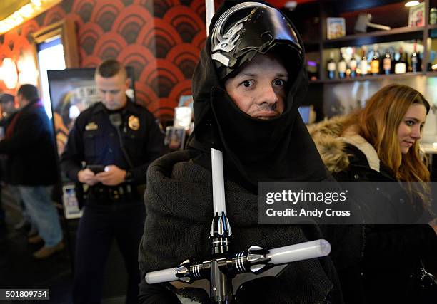 December 17: Star Wars fan Tyler Comst, dressed up as Star Wars character Kylo Ren sports a light saber at the Alamo Drafthouse Cinema before the...