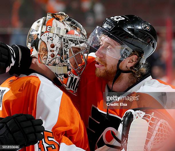 Steve Mason of the Philadelphia Flyers is congratulated by teammate Jakub Voracek after the shut out against the Vancouver Canucks on December 17,...