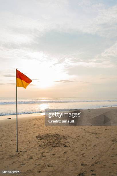 yellow & red flag on beach. - emergency services australia stock pictures, royalty-free photos & images