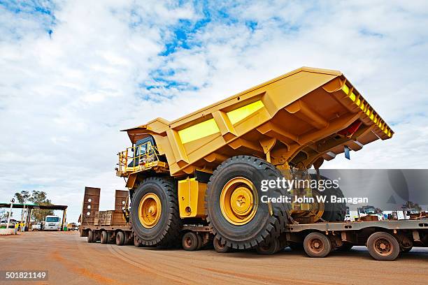 dump truck being transported, w.a. - banagan dumper truck stock pictures, royalty-free photos & images