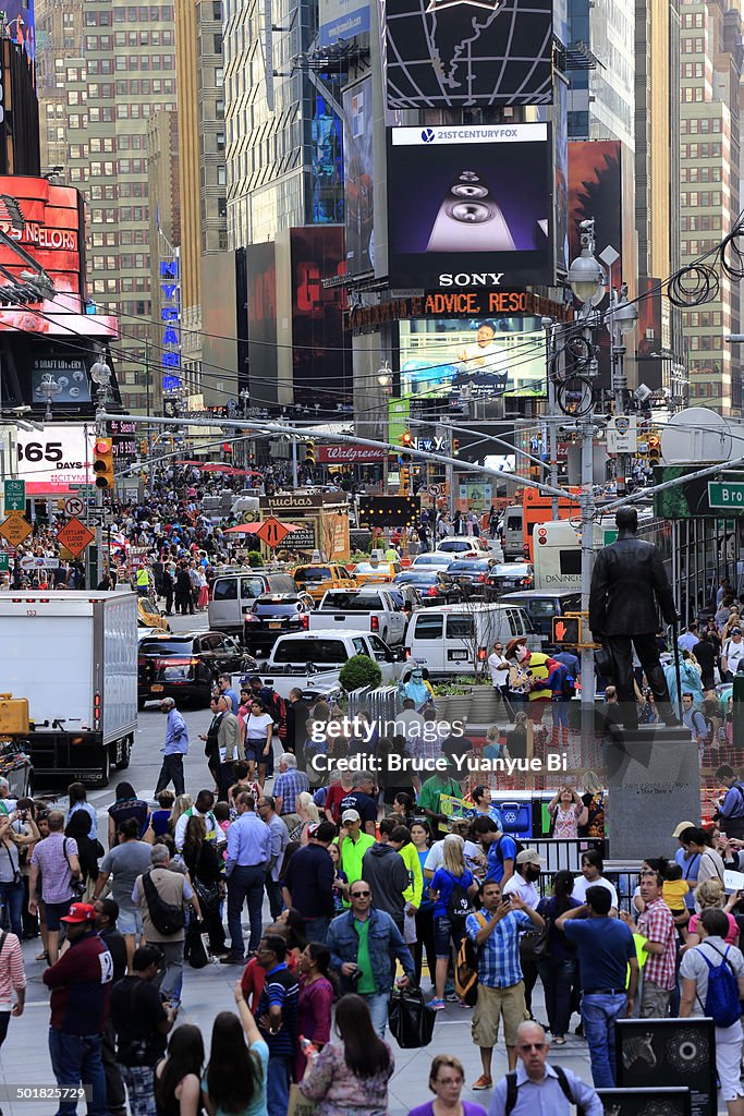 Pedestrians and cars in Times Square