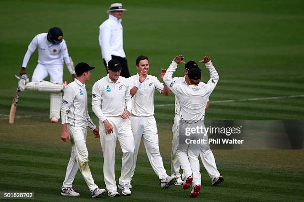 Trent Boult of New Zealand celebrates his wicket of Milinda Siriwardana of Sri Lanka during day one of the Second Test match between New Zealand and...