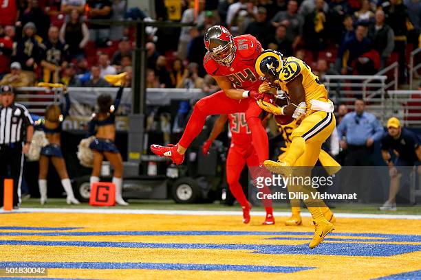 Maurice Alexander of the St. Louis Rams breaks up a pass intended for Cameron Brate of the Tampa Bay Buccaneers in the fourth quarter at the Edward...