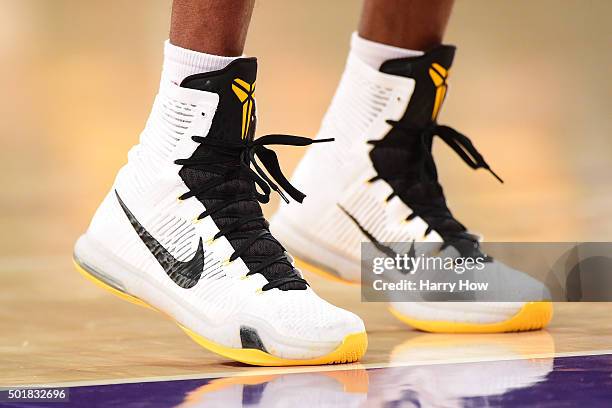 Kobe Bryant of the Los Angeles Lakers shoes as he shoots a free throw during a 107-97 Houston Rockets win at Staples Center on December 17, 2015 in...