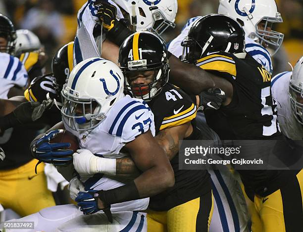 Cornerback Antwon Blake and linebacker Arthur Moats of the Pittsburgh Steelers tackle running back Zurlon Tipton of the Indianapolis Colts during a...