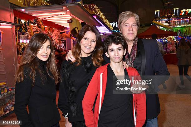 Actress Anne Parillaud, designer Lolita Lempicka, her husband Josh Lempicka and Theo Allan attend the 'Jours de Fete au Grand Palais' Fete foraine...