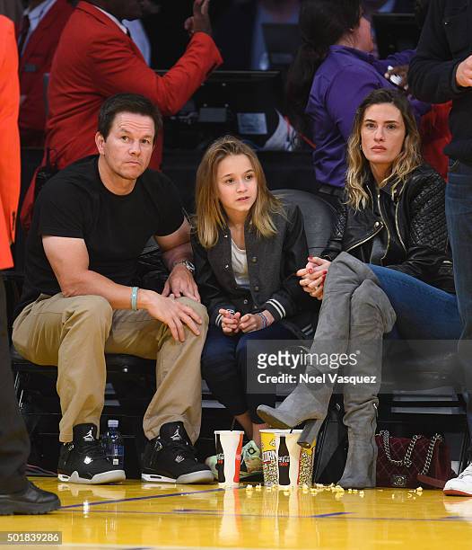 Mark Wahlberg, Ella Rae Wahlberg and Rhea Durham attend a basketball game between the Houston Rockets and the Los Angeles Lakers at Staples Center on...
