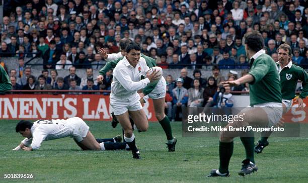 Rory Underwood of England comes inside to attack the Ireland defence during the Inaugural Millennium Trophy rugby match between Ireland and England...